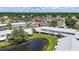 Scenic aerial view of Hampton Park community featuring a pond and lush green surroundings at 12648 Castle Hill Dr, Tampa, FL 33624