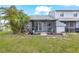 Exterior view of backyard and patio area behind home at 12648 Castle Hill Dr, Tampa, FL 33624