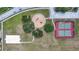 Aerial view of the Hampton Park community featuring a park, playground, tennis court, and basketball court at 12648 Castle Hill Dr, Tampa, FL 33624