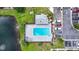 Aerial view of a refreshing community pool, complete with lounge chairs and parking spaces at 12648 Castle Hill Dr, Tampa, FL 33624