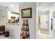 Inviting interior view of entryway leading to kitchen with white cabinets and appliances at 12648 Castle Hill Dr, Tampa, FL 33624