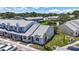 Exterior angle showcasing the front of the townhome, landscaping, and parking at 12648 Castle Hill Dr, Tampa, FL 33624