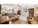 Inviting living room with tile flooring, comfortable seating, a wooden table, and stylish decor at 12648 Castle Hill Dr, Tampa, FL 33624