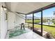 Screened patio with tile flooring and scenic water views at 12648 Castle Hill Dr, Tampa, FL 33624