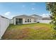 Expansive backyard with a screened-in lanai and ample space for outdoor activities at 12830 Bent Twig Dr, Riverview, FL 33579