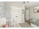 Bedroom featuring a crib and built-in closet with a closet visible nearby at 12830 Bent Twig Dr, Riverview, FL 33579