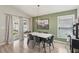Chic dining room with a modern table, stylish chairs, and a large window that offers natural light at 12830 Bent Twig Dr, Riverview, FL 33579