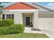 Welcoming front entrance with a charming wreath on the door and manicured landscaping at 12830 Bent Twig Dr, Riverview, FL 33579