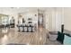 Open-concept kitchen featuring stainless steel appliances, gray cabinets, and a large island with bar stool seating at 12830 Bent Twig Dr, Riverview, FL 33579