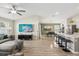 Open-concept living area with a large sectional couch, perfect for entertaining guests and Gathering at 12830 Bent Twig Dr, Riverview, FL 33579