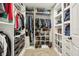 Well-organized walk-in closet with custom shelving and rods at 12830 Bent Twig Dr, Riverview, FL 33579