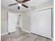 Bedroom featuring a ceiling fan, wood-look floors, and a closet with paneled doors at 1310 43Rd S St, St Petersburg, FL 33711
