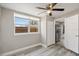 Light-filled bedroom with wood-look floors and a window overlooking the backyard at 1310 43Rd S St, St Petersburg, FL 33711
