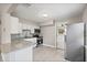 Kitchen featuring white cabinets, granite counters and stainless steel appliances at 1310 43Rd S St, St Petersburg, FL 33711
