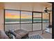 Enjoy spectacular ocean views from this private balcony, perfect for relaxation or entertaining with lounge chairs and a ceiling fan at 13720 Gulf Blvd # 302, Madeira Beach, FL 33708