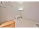 Cozy bedroom featuring a twin bed, nightstand, and palm tree accent pillow at 13720 Gulf Blvd # 302, Madeira Beach, FL 33708