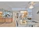 Bright dining area open to the kitchen and living space featuring tile floors at 13720 Gulf Blvd # 302, Madeira Beach, FL 33708