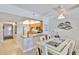 Cozy dining area with open access to the kitchen with stainless appliances and a breakfast bar at 13720 Gulf Blvd # 302, Madeira Beach, FL 33708