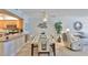 Charming dining area open to the kitchen, featuring a modern table and chairs, perfect for enjoying meals at 13720 Gulf Blvd # 302, Madeira Beach, FL 33708