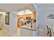 Well-equipped kitchen with stainless steel appliances and a breakfast bar overlooking the dining and living areas at 13720 Gulf Blvd # 302, Madeira Beach, FL 33708