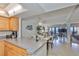 Open floor plan showcases the kitchen, dining, and living areas with access to breathtaking views of the Gulf of Mexico at 13720 Gulf Blvd # 302, Madeira Beach, FL 33708