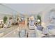 Open living space with neutral walls and floors and floor to ceiling mirrors at 13720 Gulf Blvd # 302, Madeira Beach, FL 33708