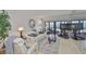 Inviting living room with modern decor, comfortable seating, and expansive windows offering beautiful beach views at 13720 Gulf Blvd # 302, Madeira Beach, FL 33708