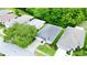 Aerial view of a lovely single-story home showcasing its landscaping and proximity to mature trees at 14116 Whitecap Ave, Hudson, FL 34667