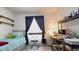 Bright bedroom with natural light, a comfortable twin bed, and desk area for work or study at 14116 Whitecap Ave, Hudson, FL 34667