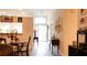 Bright foyer with wood-look flooring leads into an open living space at 14116 Whitecap Ave, Hudson, FL 34667