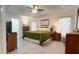 Spacious main bedroom features bright white walls, tray ceiling, and wood-look flooring at 14116 Whitecap Ave, Hudson, FL 34667