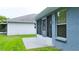 Screened in porch with an adjacent building in the background at 14116 Whitecap Ave, Hudson, FL 34667