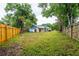 A large fenced yard offers privacy and space for outdoor activities with a well-maintained lawn at 14902 Foxhound Pl, Tampa, FL 33624
