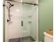 Contemporary bathroom featuring a glass shower with subway tile surround and modern fixtures at 14902 Foxhound Pl, Tampa, FL 33624