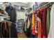 Walk-in closet with abundant storage, organized shelves and hanging space for clothes and accessories at 14902 Foxhound Pl, Tampa, FL 33624