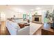 Bright, open living room with a fireplace, hardwood floors, and comfortable seating at 14902 Foxhound Pl, Tampa, FL 33624