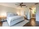 Serene bedroom with minimalist decor, wooden floors, and a walk-in closet at 14902 Foxhound Pl, Tampa, FL 33624