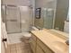 This bathroom offers a vanity and shower-tub combination at 16330 Gulf Blvd # 201, Redington Beach, FL 33708