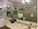 This bathroom offers a vanity and shower-tub combination at 16330 Gulf Blvd # 201, Redington Beach, FL 33708