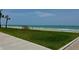 Beautiful white sand beach featuring clear water and grassy area for picnics and recreation at 16330 Gulf Blvd # 201, Redington Beach, FL 33708