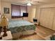 A well-lit bedroom includes a ceiling fan, spacious closet, and comfortable furnishings at 16330 Gulf Blvd # 201, Redington Beach, FL 33708