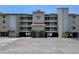 Three story condo building offering covered parking, balconies, and convenient beach access at 16330 Gulf Blvd # 201, Redington Beach, FL 33708
