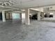 Large parking garage featuring dedicated parking, solid support columns, with partial view of the beach at 16330 Gulf Blvd # 201, Redington Beach, FL 33708