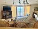 Comfortable living room features a balcony overlooking the ocean for serene views and relaxation at 16330 Gulf Blvd # 201, Redington Beach, FL 33708
