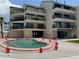 Beautiful building with a large pool, ocean view, and balconies to enjoy the outdoors at 16330 Gulf Blvd # 201, Redington Beach, FL 33708