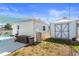 Backyard featuring a shed, lush greenery, and a glimpse of the inviting pool area for relaxation at 1701 66Th N Ave, St Petersburg, FL 33702