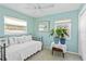 Guest bedroom featuring a day bed, two windows, and plants at 1701 66Th N Ave, St Petersburg, FL 33702