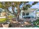 Charming home exterior featuring mature landscaping, lovely patio area, and a welcoming facade at 1701 66Th N Ave, St Petersburg, FL 33702