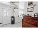 Well-lit kitchen with white cabinets and stainless appliances, next to the entry door at 1701 66Th N Ave, St Petersburg, FL 33702