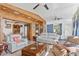 Open-concept living room with tiled floors, comfortable seating, and seamless flow to other rooms at 1701 66Th N Ave, St Petersburg, FL 33702